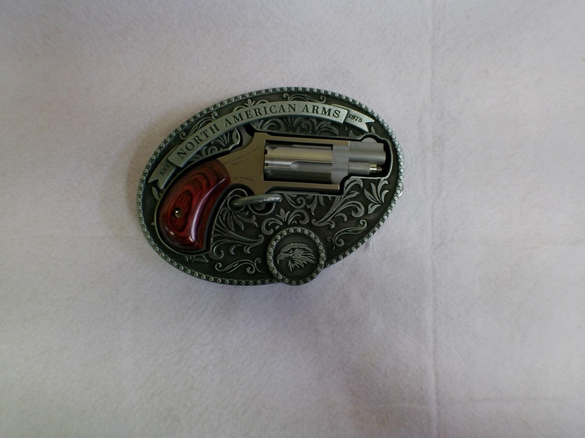 North American Arms mini revolver mounted in an engraved commemorative belt buckle